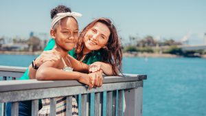 A Mother and Her Daughter Smiling