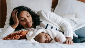 Mother Looking at Her Sleeping Baby