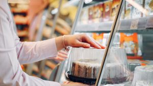 Person Buying a Cake