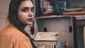 Woman Using Typewriter